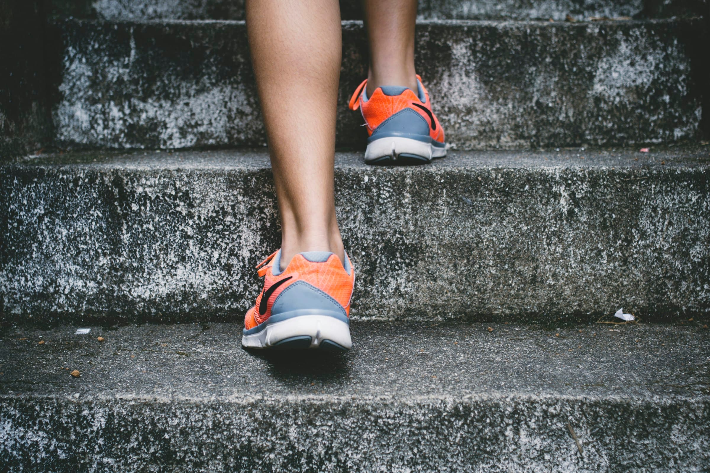 Recreational runner starting a neighborhood run at sunrise
